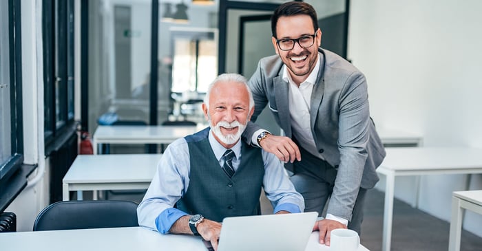 Photography of 2 men in an office