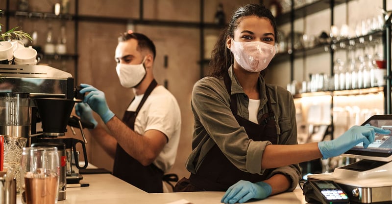 Photography of two people working in a bar