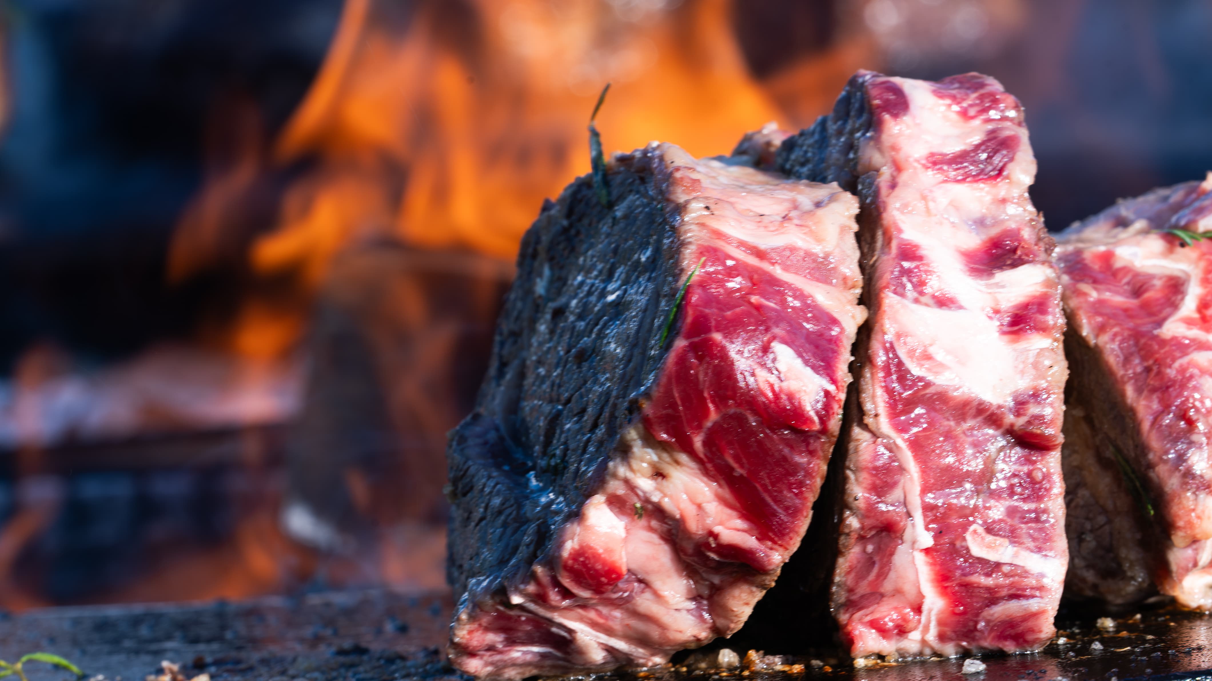 Beef cooking on an open fire bbq