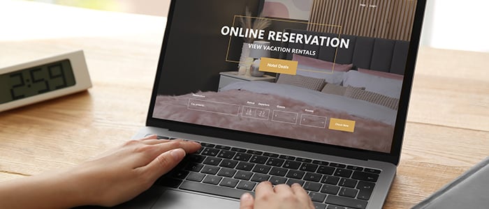 someone books a hotel from a laptop