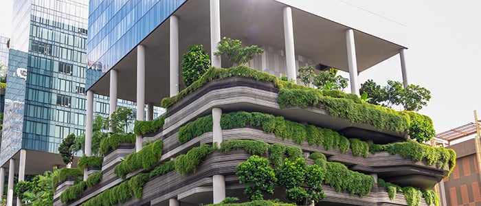 Hotel with lots of plants on the balconies