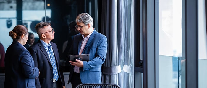 manager talking with two members of his team