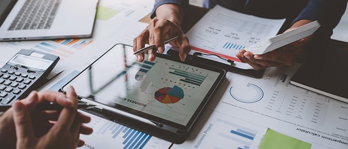 Two people are trying to determine the price of the hotel.