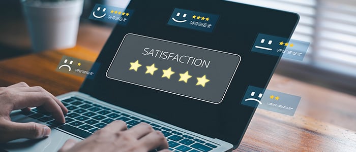 hotelier reviewing online guest feedback