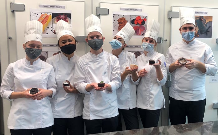 Photography of the EHL's students with lava cakes