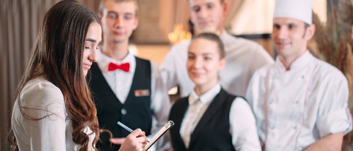 Hotel manager taking morning meeting