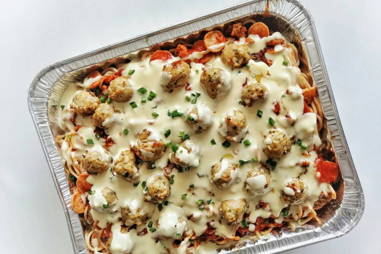 Bechamel drizzled over pasta