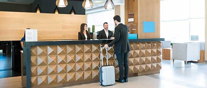 A man booking a room in a hotel