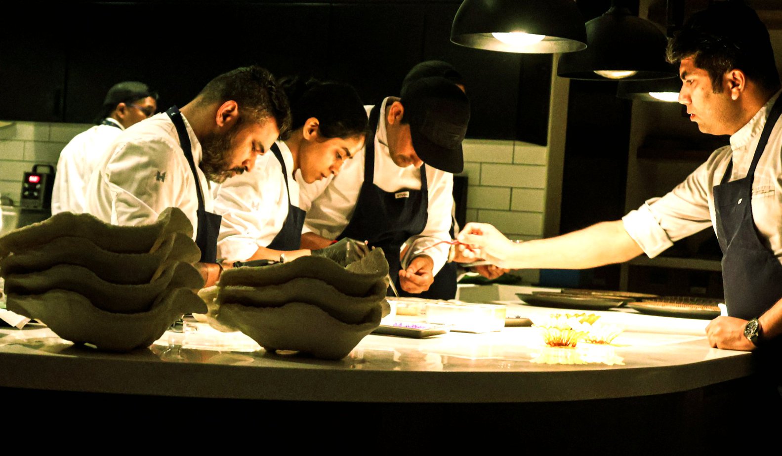 A head chef training other chefs