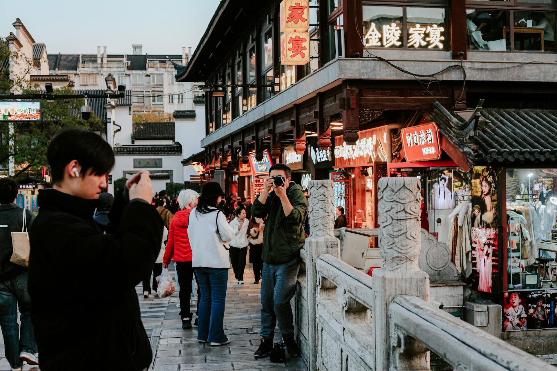 Locals photographing a vibrant street