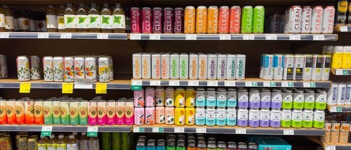 shelf displaying various plant-based drinks