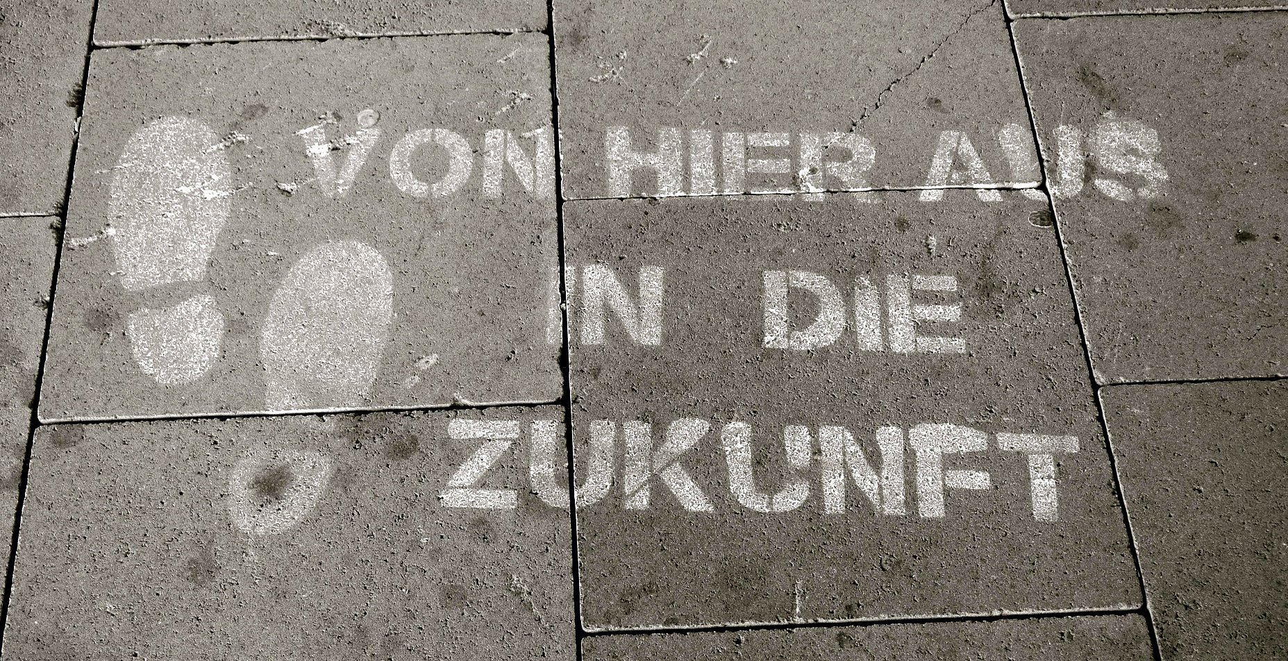 "from here on into the future" printed on pavement