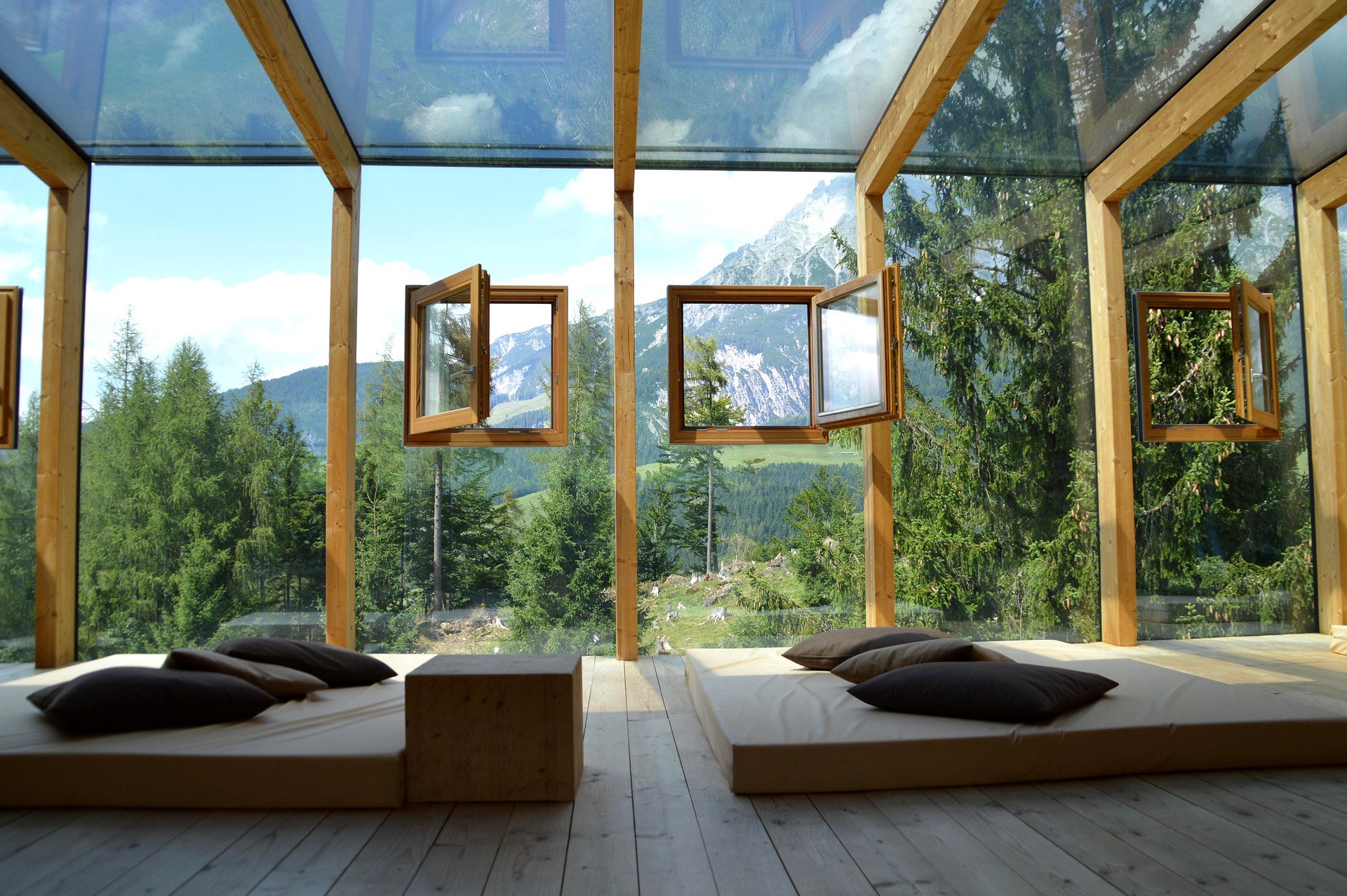 Wood-frame windows integrated into glass walls