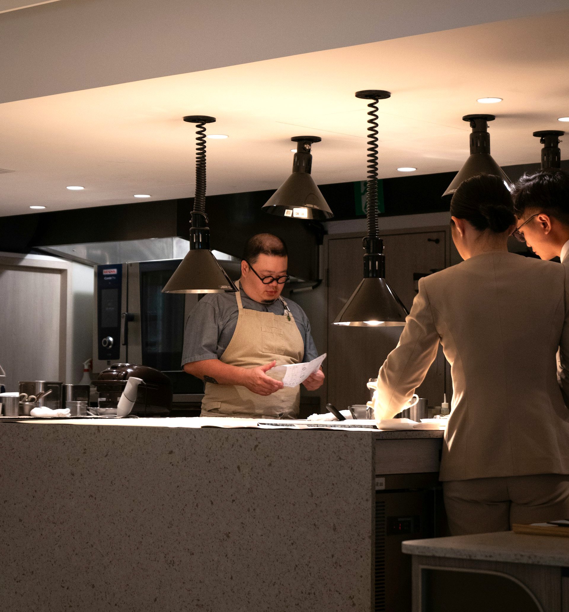 Head chef talking to employees