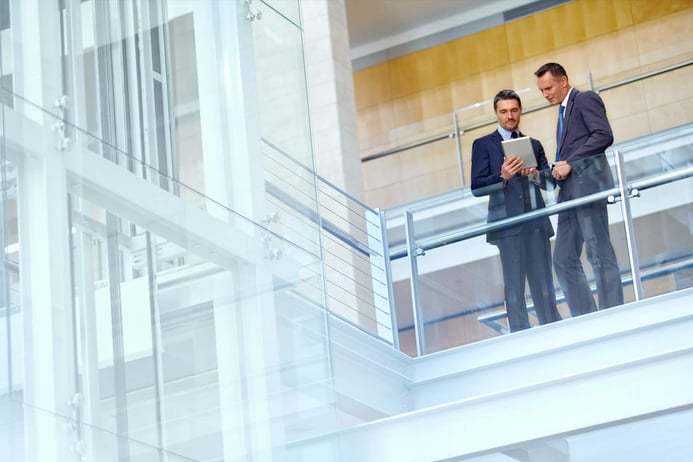 hotel businessmen looking at a tablet