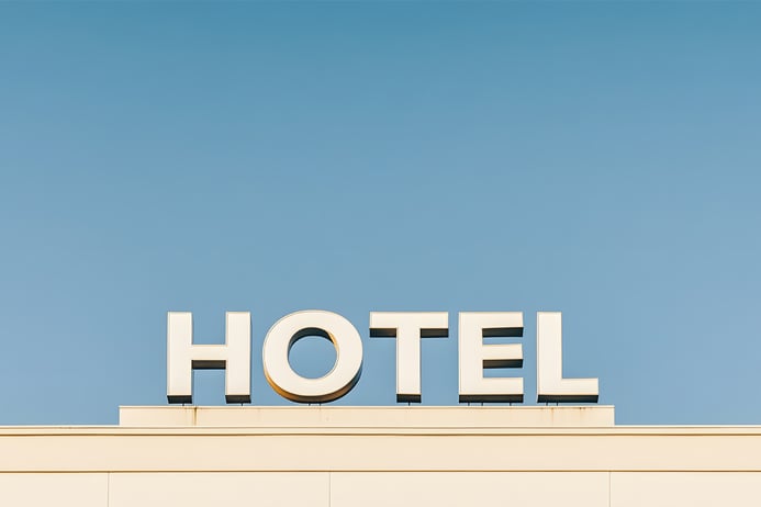 hotel sign against clear blue sky