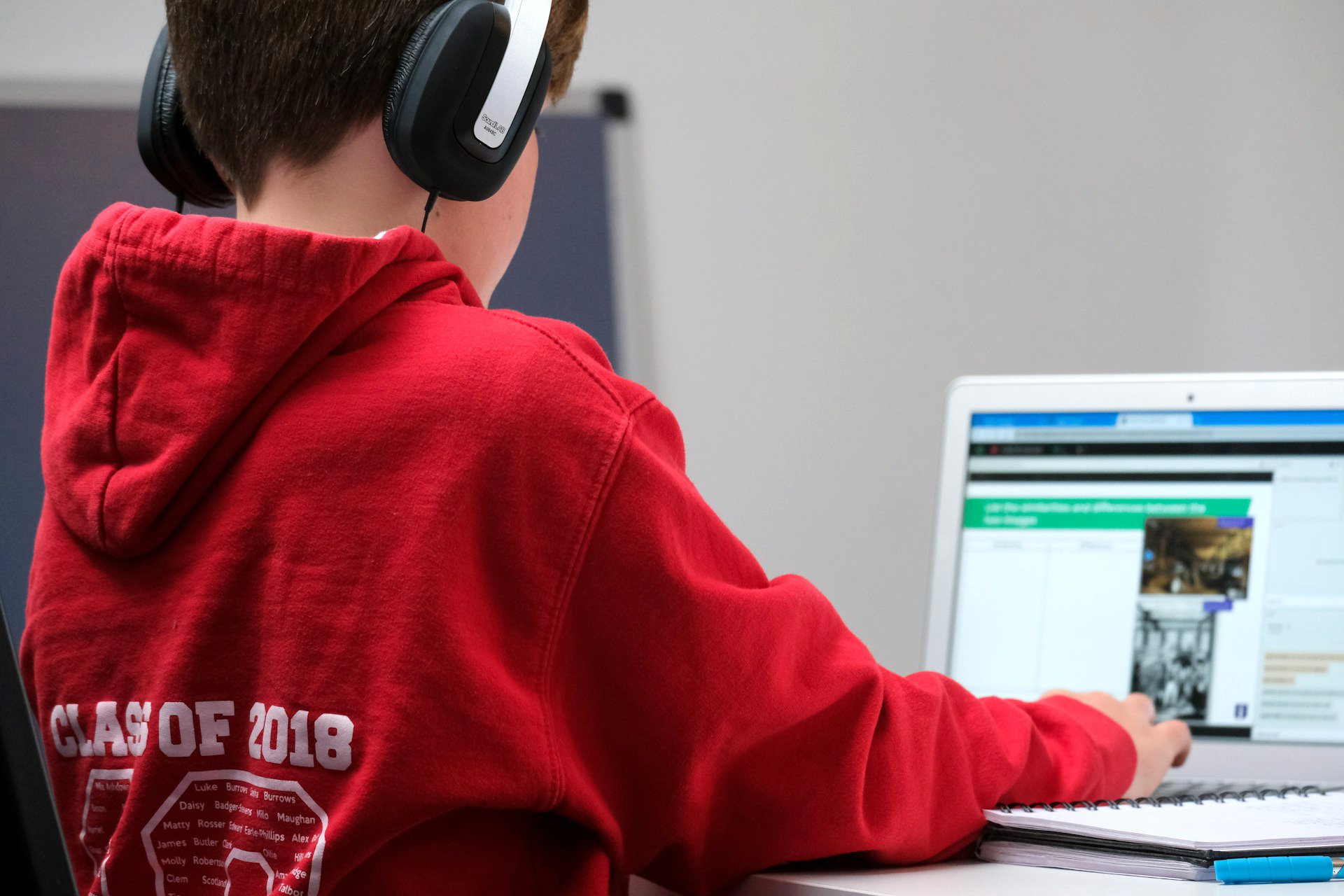 A kid using a computer to learn and study