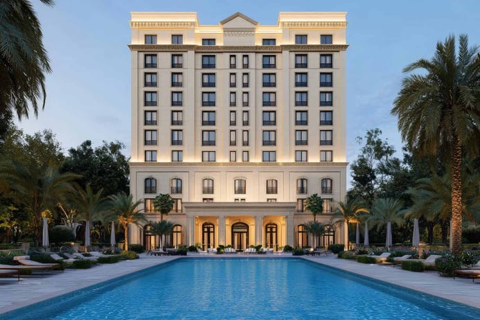 Luxury hotel with grand entrance and pool
