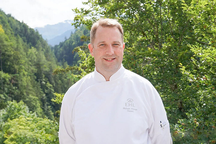 a portrait of Chef Michael Piliman in nature