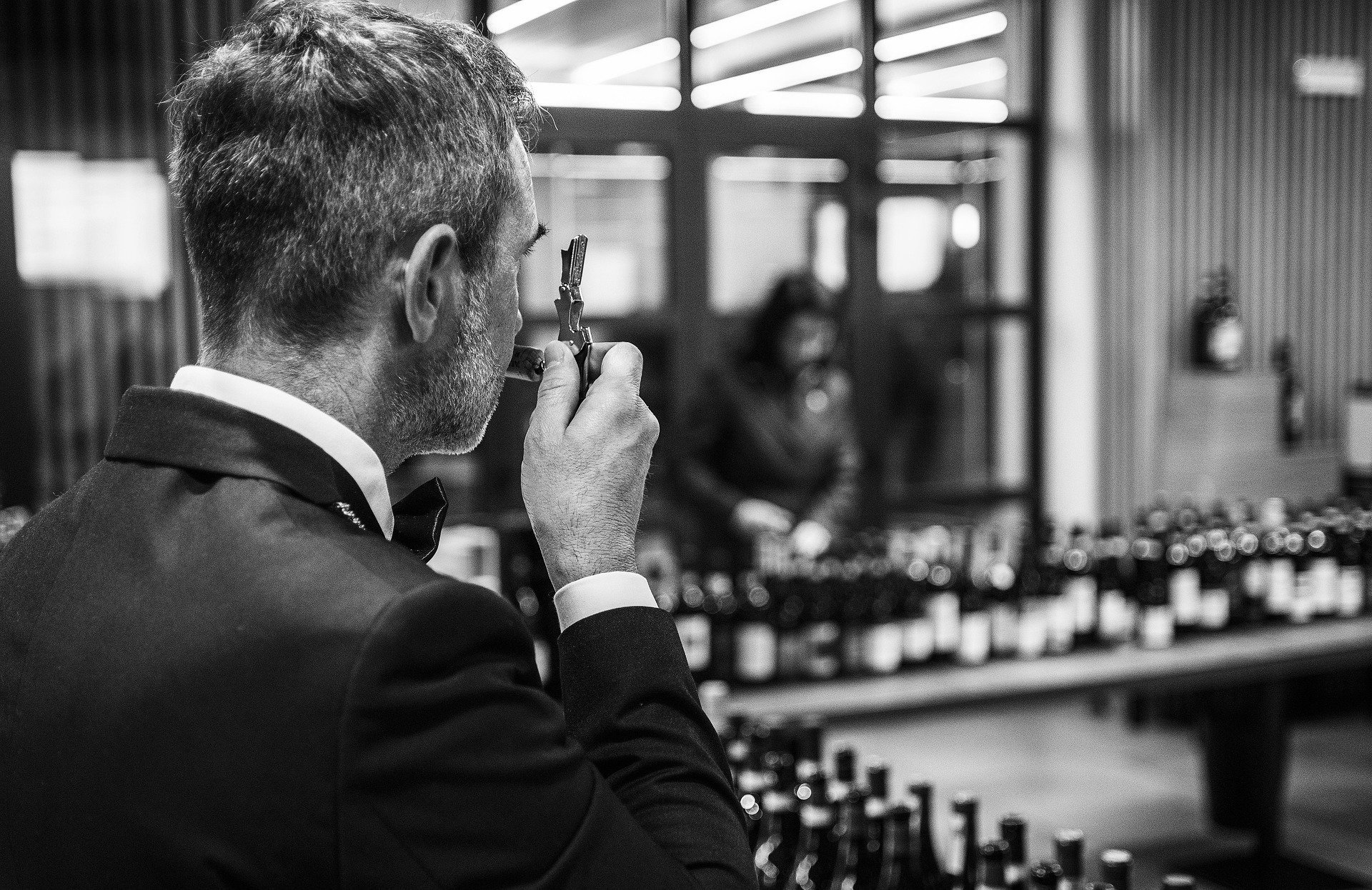 Man sniffing a wine bottle cork