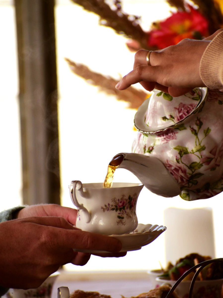 Pouring tea into a cup