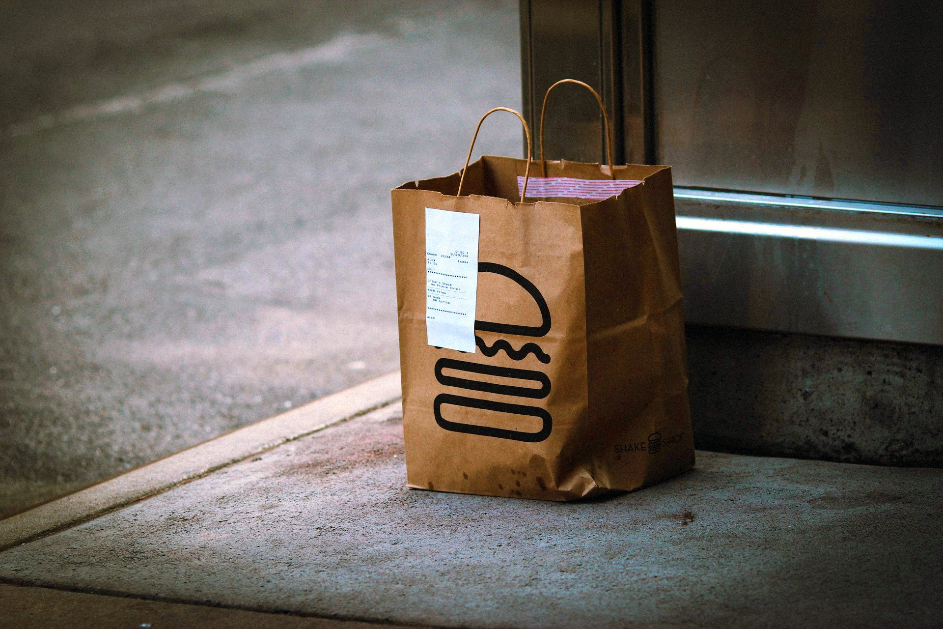 Quick commerce delivery bag on sidewalk