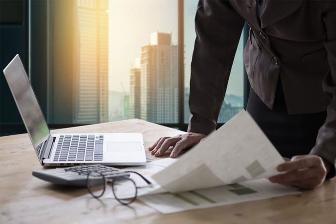 revenue manager looking over balance sheets