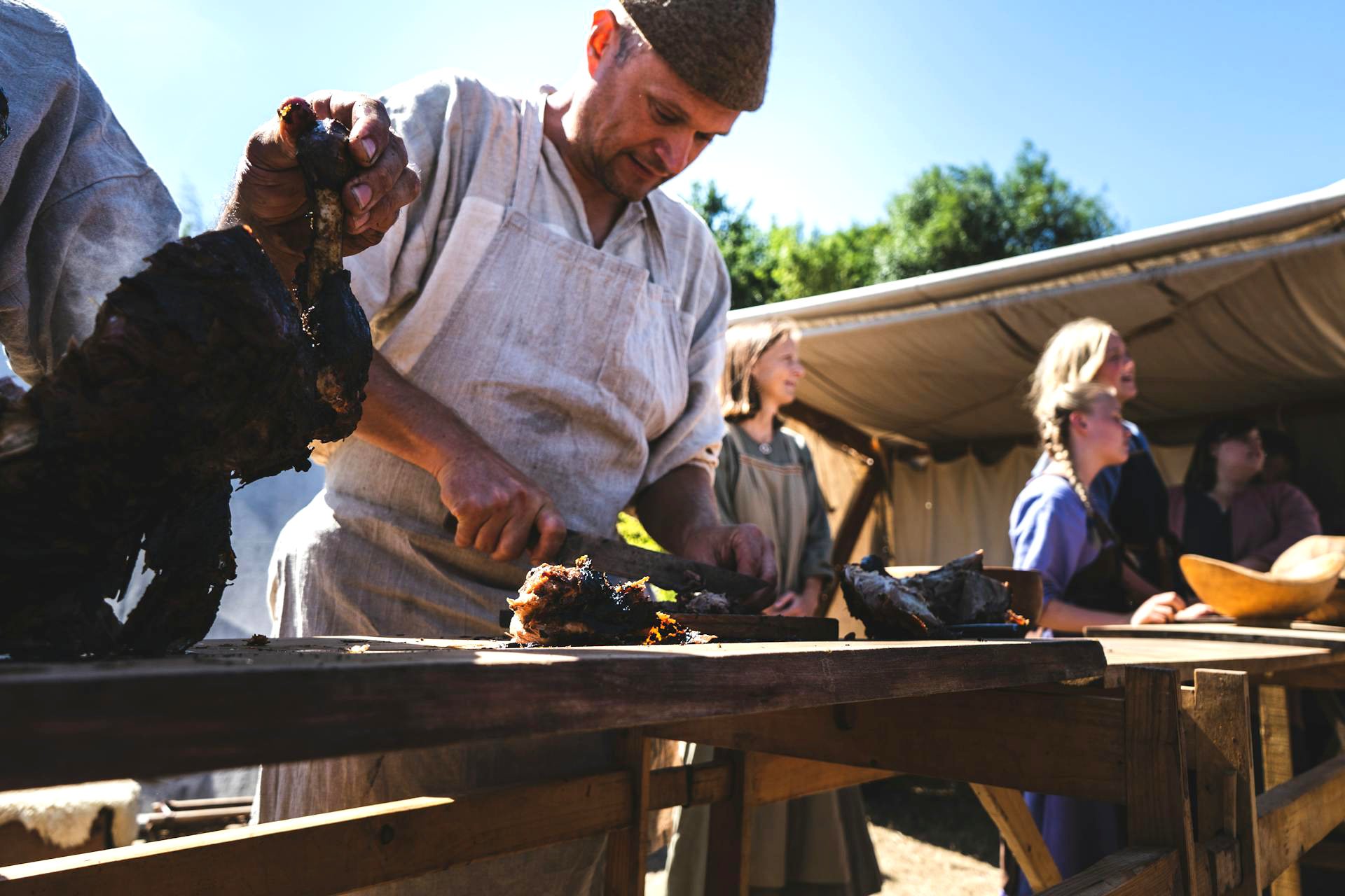 Person serving lamb chops