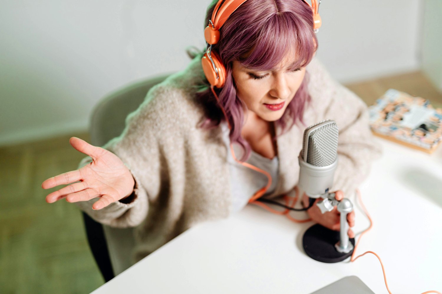 Person speaking into a mic