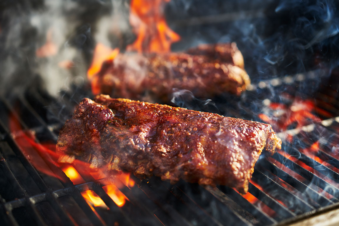 Juicy meat cooking on a grill