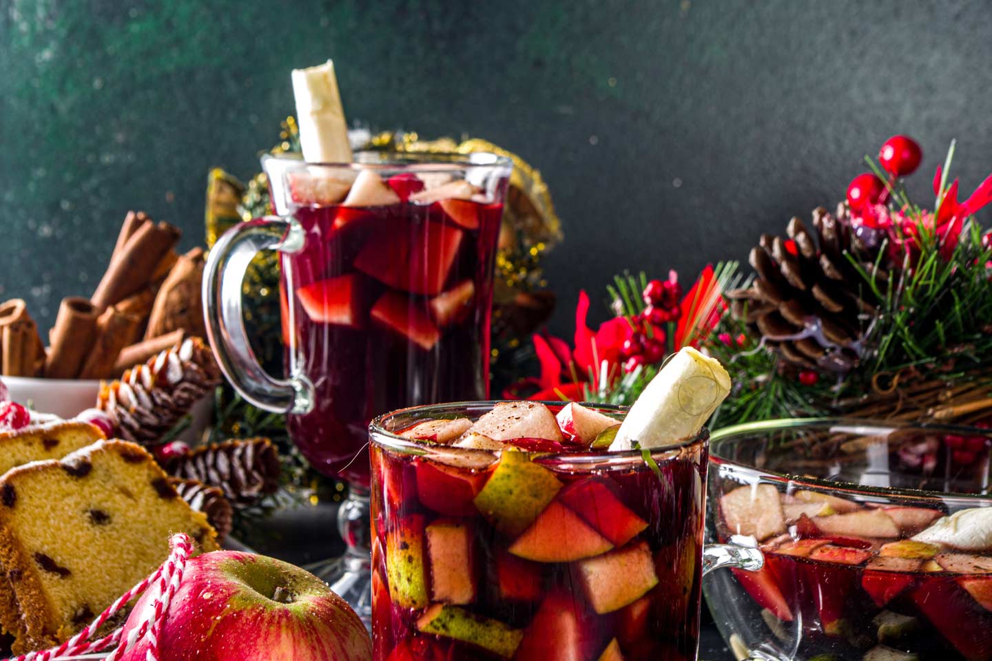 glasses with sorrel Punch, fruits, and christmas cakes